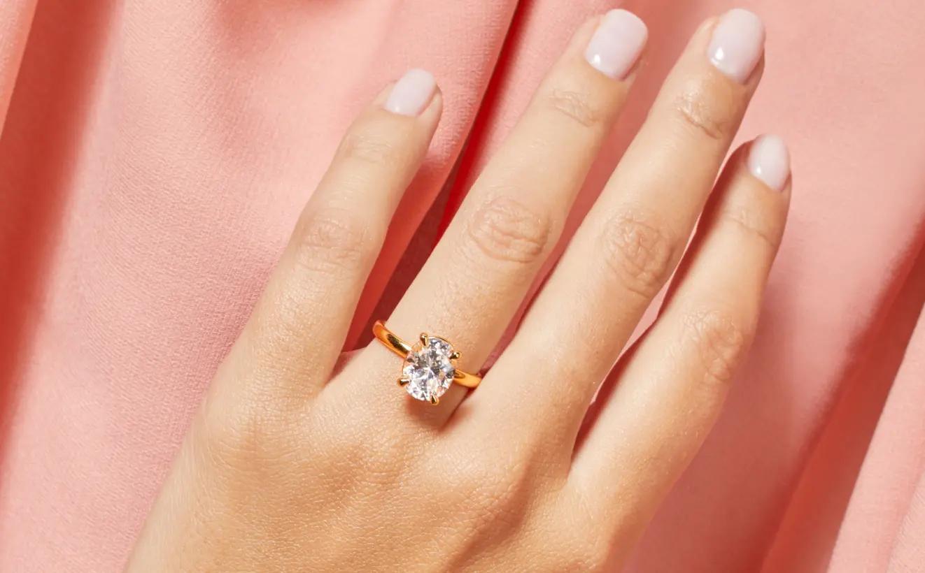 A single 14K Yellow Gold Diamond engagement ring
